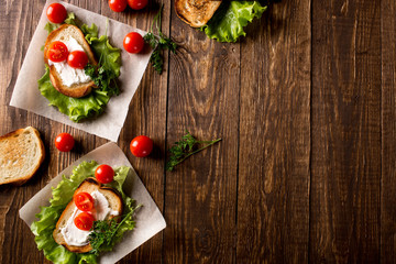 Homemade Burger with tomatoes and lettuce. Fast food.