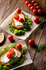 Homemade Burger with tomatoes and lettuce. Fast food.