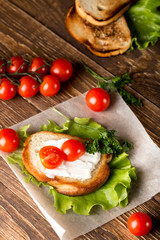 Fototapeta na wymiar Homemade Burger with tomatoes and lettuce. Fast food.
