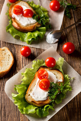 Homemade Burger with tomatoes and lettuce. Fast food.