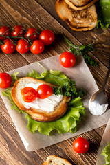 Homemade Burger with tomatoes and lettuce. Fast food.