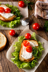 Homemade Burger with tomatoes and lettuce. Fast food.
