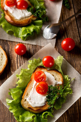 Homemade Burger with tomatoes and lettuce. Fast food.