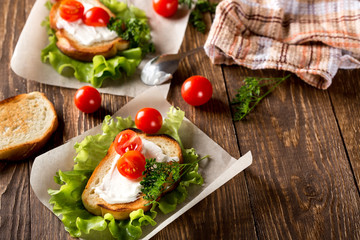Homemade Burger with tomatoes and lettuce. Fast food.