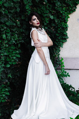 Beautiful girl in long white dress