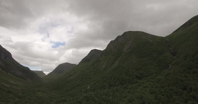 4k Drone footage of majestic mountain filmed backwards in the summer in Skorgedalen, Orsta summer in Norway.