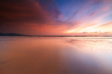 Fototapeta premium sunrise Seascape with beautiful reflection for background. soft focus due to long expose.