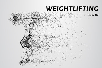 Fototapeta na wymiar Weightlifter of particles. Weightlifter is preparing to raise the bar.