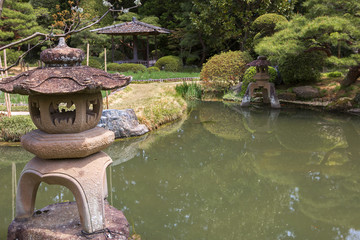 Naklejka premium Sendai, Japan, the lamp in the garden of Rinnoji temple. Toro is a traditional Japanese lamp made of stone. Like many other elements of traditional Japanese architecture, it is of Chinese origin.