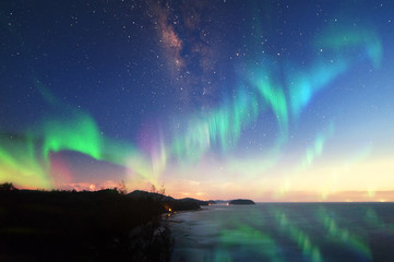 Milkyway with beautiful aurora Borealis. soft focus and noise due to long expose and high iso.