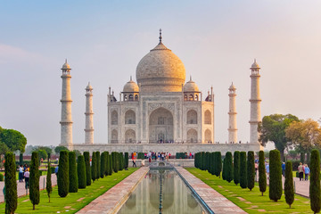 Fototapeta premium Taj Mahal front view reflected on the reflection pool, an ivory-white marble mausoleum on the south bank of the Yamuna river in Agra, Uttar Pradesh, India. One of the seven wonders of the world.