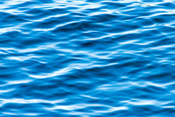 The texture and bright blue colour of the ocean water