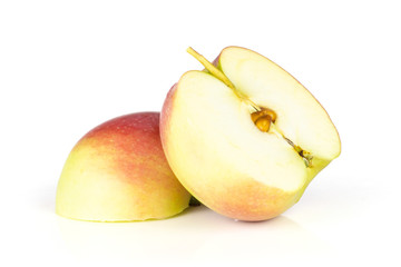 Group of two halves of fresh red apple james grieve variety isolated on white background
