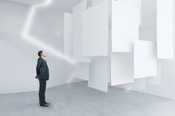 Fototapeta premium Businessman looking at posters