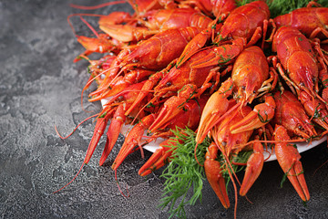 Crayfish. Red boiled crawfishes on table in rustic style, closeup. Lobster closeup. Border design
