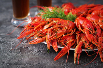 Crayfish. Red boiled crawfishes on table in rustic style, closeup. Lobster closeup. Border design