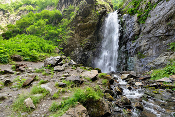 Fototapeta na wymiar Gveleti Small Waterfalls being in a Dariali Gorge near the Kazbegi city in the mountains of the Caucasus, Geprgia