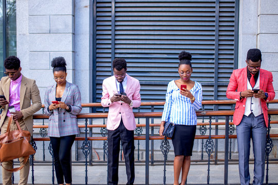 young people can't imagine their life without mobile phones. twitter, facebook concept. amazing breathtaking online game. everybody uses smart phones
