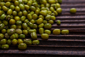fresh Mung beans on a rustic wooden background