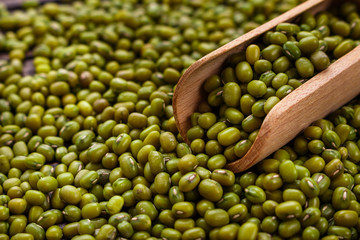 fresh Mung beans on a rustic wooden background
