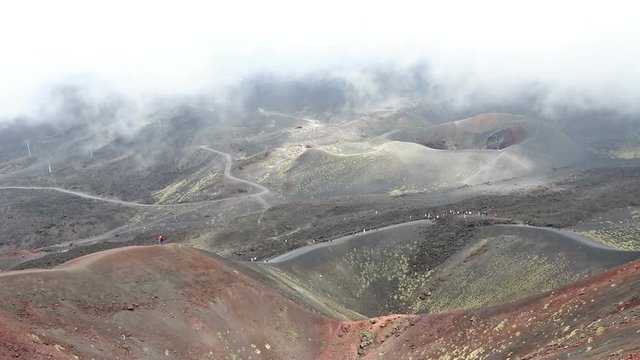 Panoramic view of Crater Silvestri Superiori (2001m) on Mount Etna, Etna national park, Sicily, Italy. Silvestri Superiori - lateral crater of the 1892 year eruption. Volcanic foggy landscape