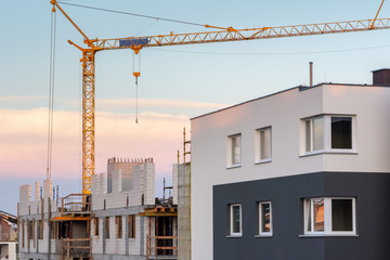 Modern residential building on a construction site.