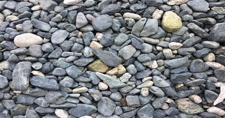 Abstract smooth round pebbles sea texture background. Stone rock background texture.