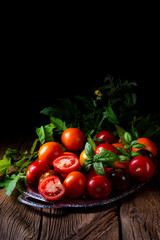 various types of tomatoes served and presented on the silver platter.