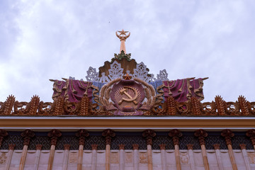 Moscow, Russia, 05.03.2018. Central, the main pavilion of VDNKH. Pompous, with the old symbols of the Soviet Union, decorated with gold spire, columns, sculptures and bas-reliefs