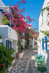 View of a typical narrow street in old town of Naoussa, Paros island, Cyclades, Greece
