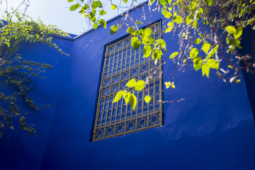 Ornate metal grille on a blue building, Marrakesh