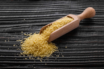 fresh couscous on a wooden rustic background