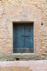 Fototapeta na wymiar Old blue door, Italy
