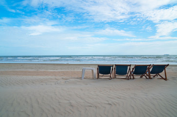     Beautiful Tropical beach Blue sea  blue sky and white sand beach with beach chairs . Summer vacation .