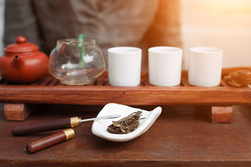 Chinese tea ceremony is perfomed by tea master in kimono