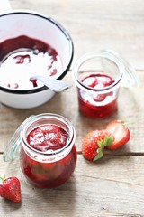 Strawberry marmalade. Homemade strawberry jam in glass jar overhead rustic wooden table. Copy space