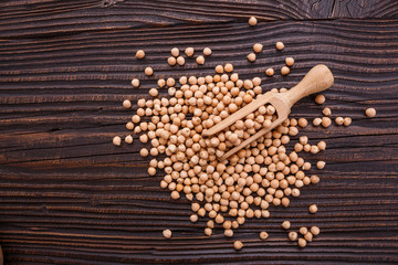 uncooked chickpeas on a wooden rustic background