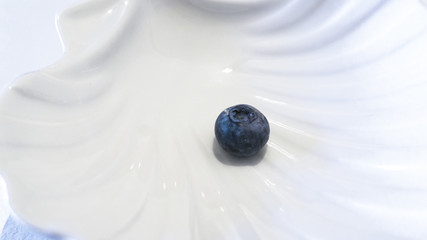 Blueberries and cranberries, berries on a white background. Berry light background.