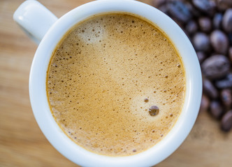 Cup of coffee, powder coffee and scoop on rusty background