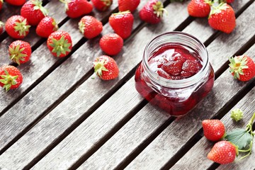 Strawberry marmalade. Homemade strawberry jam in glass jar overhead rustic wooden table. Copy space