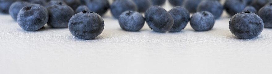 Blueberries and cranberries, berries on a white background. Berry light background.