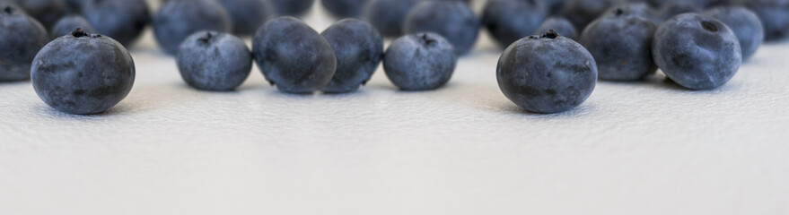 Blueberries and cranberries, berries on a white background. Berry light background.