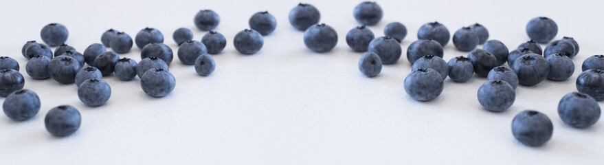 Blueberries and cranberries, berries on a white background. Berry light background.