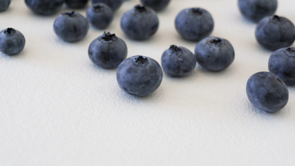 Blueberries and cranberries, berries on a white background. Berry light background.