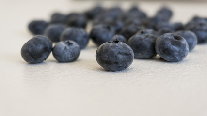 Blueberries and cranberries, berries on a white background. Berry light background.