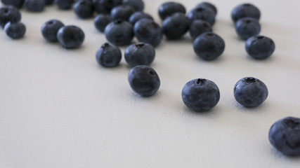 Blueberries and cranberries, berries on a white background. Berry light background.