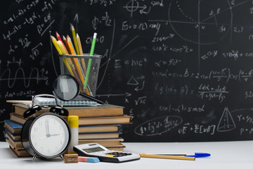 School background, with a stack of books