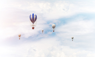 Flying hot air balloons in the air.