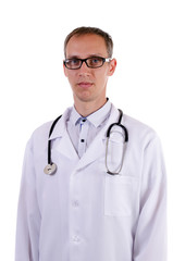 Doctor in glasses and in a dressing gown with a stethoscope on a white background