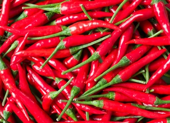 Fotobehang Chili Pepers bright red bird eye chili food background  © fkruger